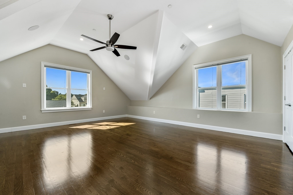 884 Adams Street, Unit 3 Boston, MA 02124 - Photo 20 of 24 a view of an empty room with wooden floor and a window