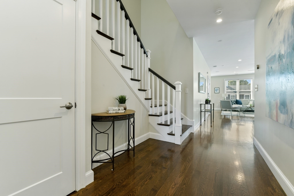 884 Adams Street, Unit 3 Boston, MA 02124 - Photo 2 of 24 a view of entryway and hall with wooden floor