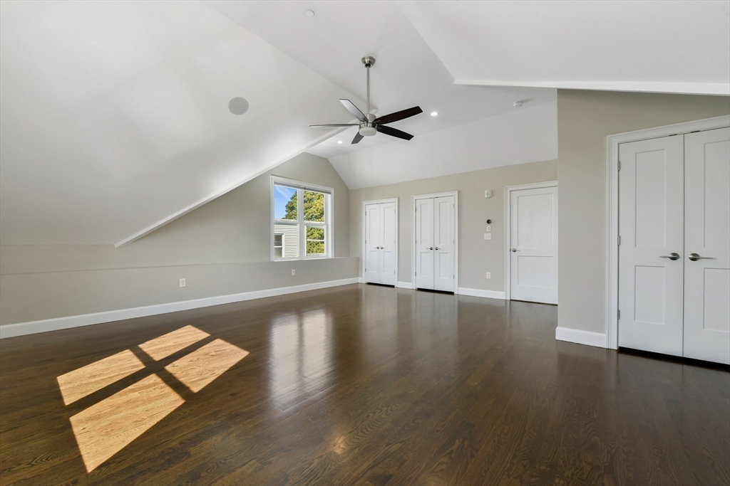 884 Adams Street, Unit 3 Boston, MA 02124 - Photo 21 of 24 a view of an empty room with window and wooden floor