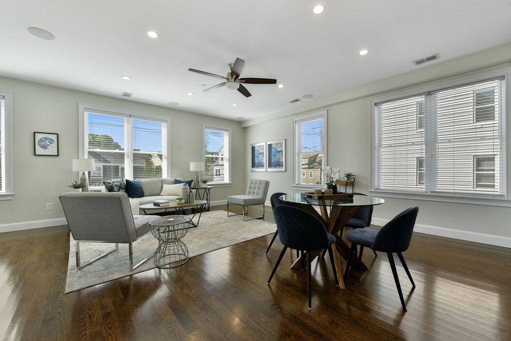 884 Adams Street, Unit 3 Boston, MA 02124 - Photo 6 of 24 a view of a dining room with furniture window and wooden floor