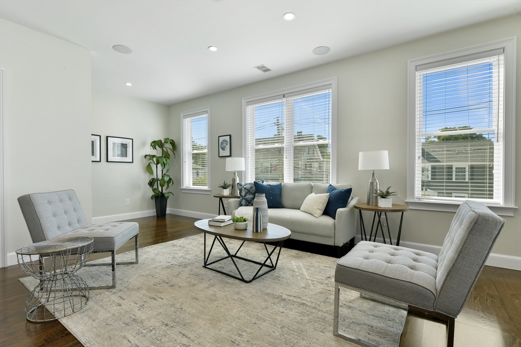 884 Adams Street, Unit 3 Boston, MA 02124 - Photo 8 of 24 a living room with furniture and a large window