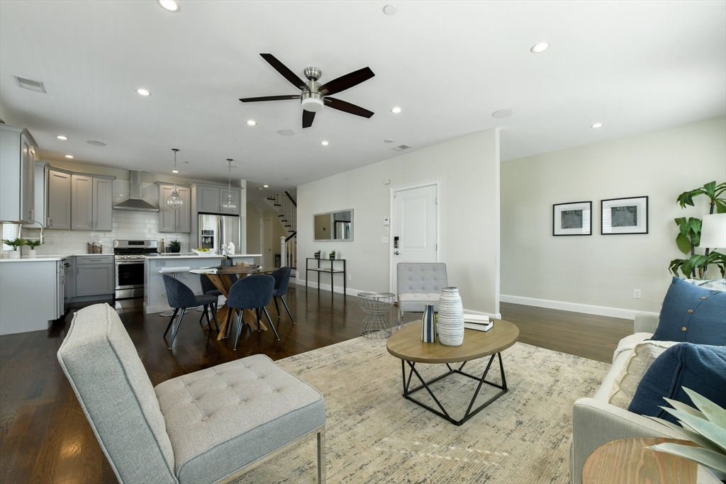884 Adams Street, Unit 3 Boston, MA 02124 - Photo 9 of 24 a living room with furniture and kitchen view