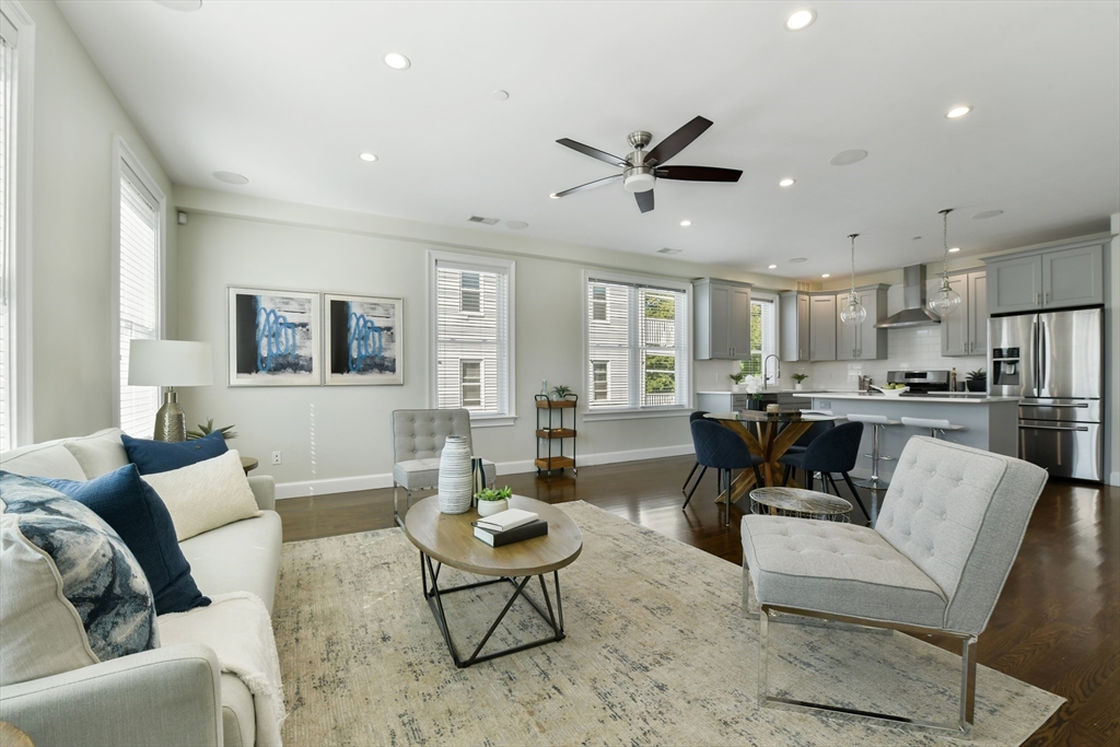 884 Adams Street, Unit 3 Boston, MA 02124 - Photo 10 of 24 a living room with furniture and kitchen view