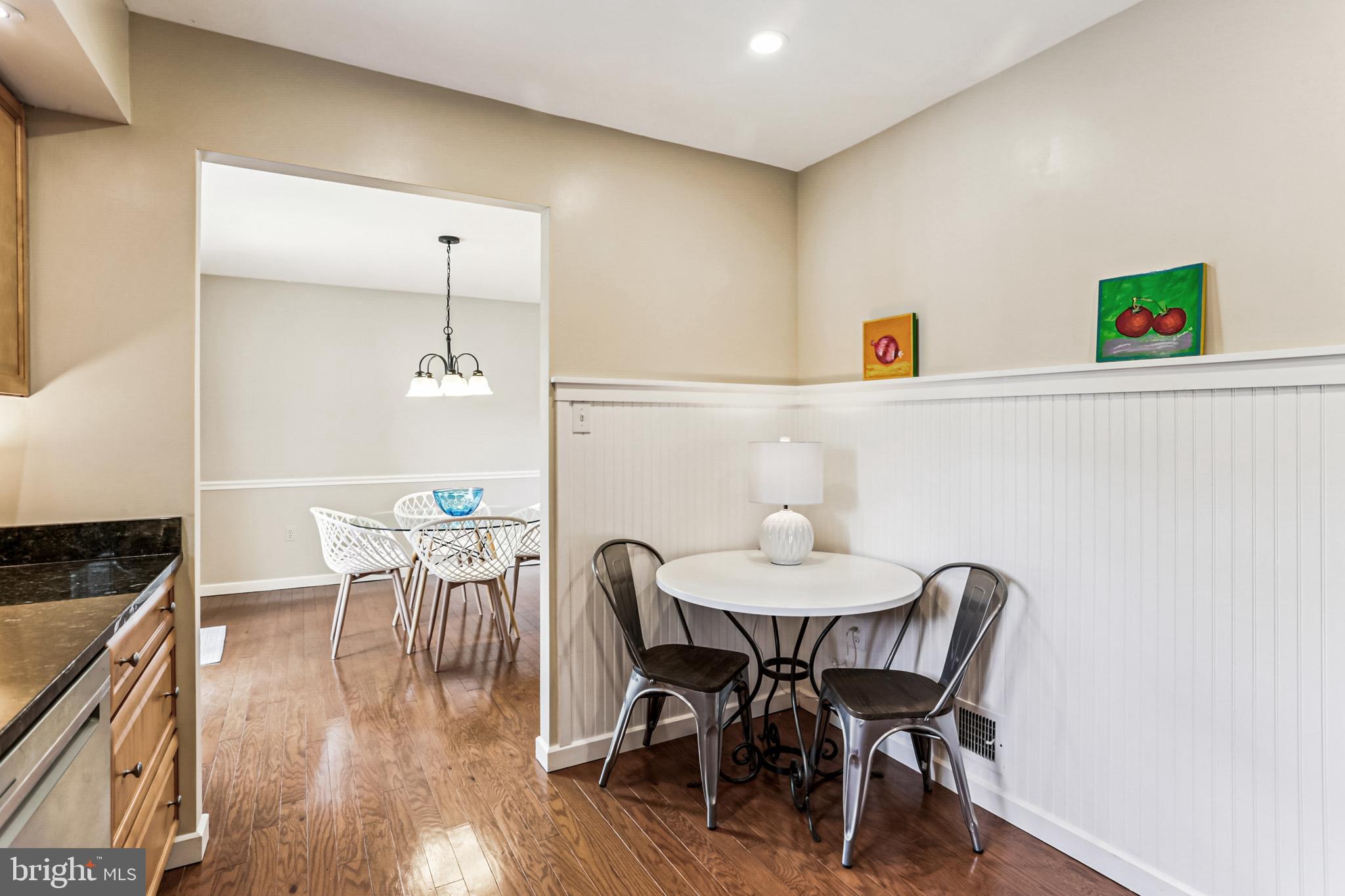 9013 2nd Avenue Silver Spring, MD 20910 - Photo 16 of 56 a view of a dining room with furniture and wooden floor