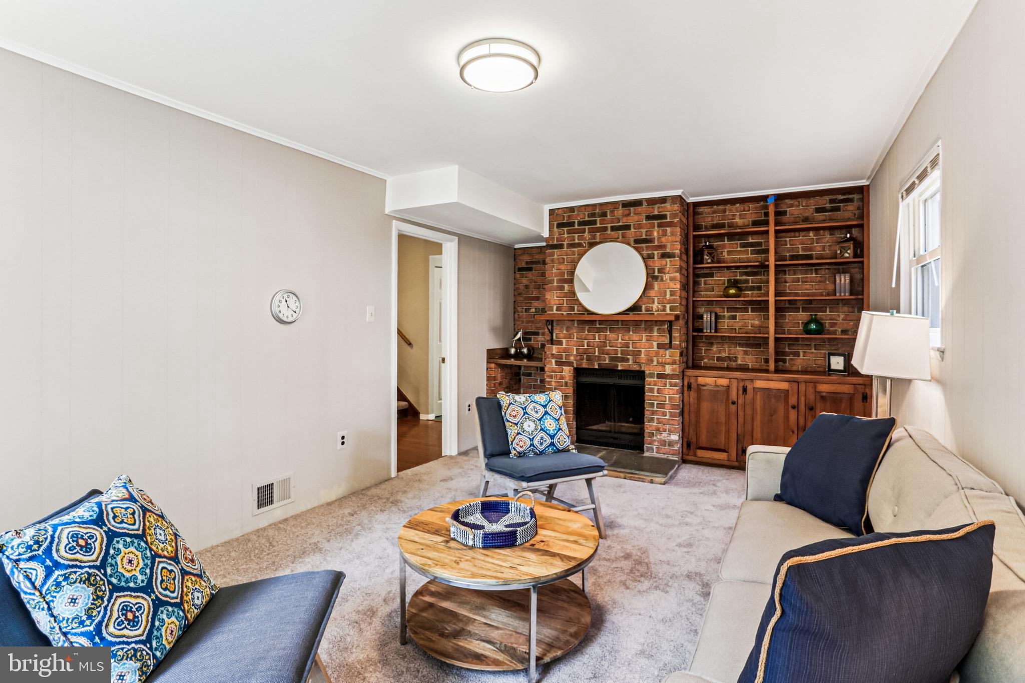 9013 2nd Avenue Silver Spring, MD 20910 - Photo 23 of 56 a living room with furniture and a fireplace