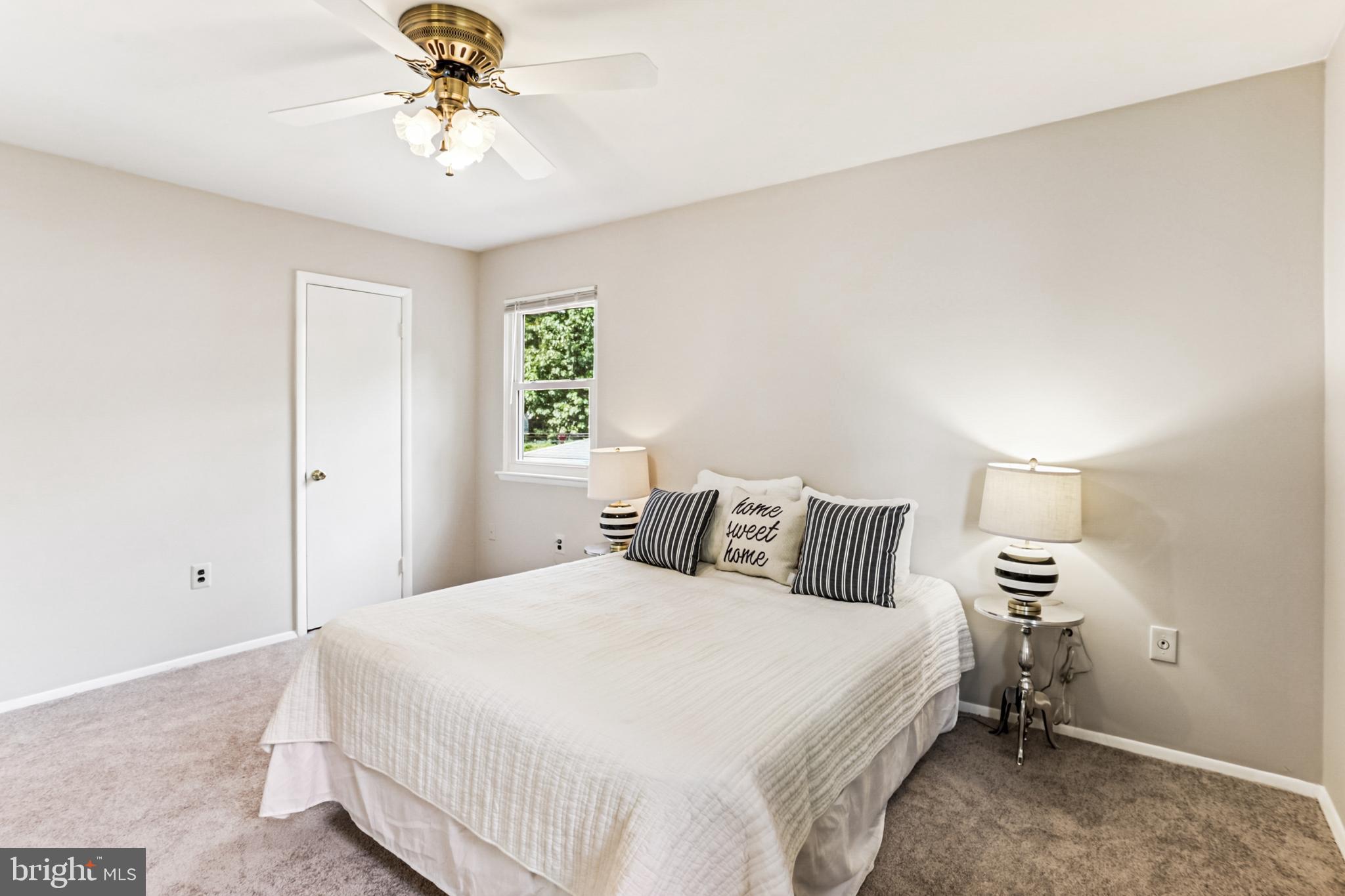9013 2nd Avenue Silver Spring, MD 20910 - Photo 30 of 56 a bedroom with a bed and a chandelier