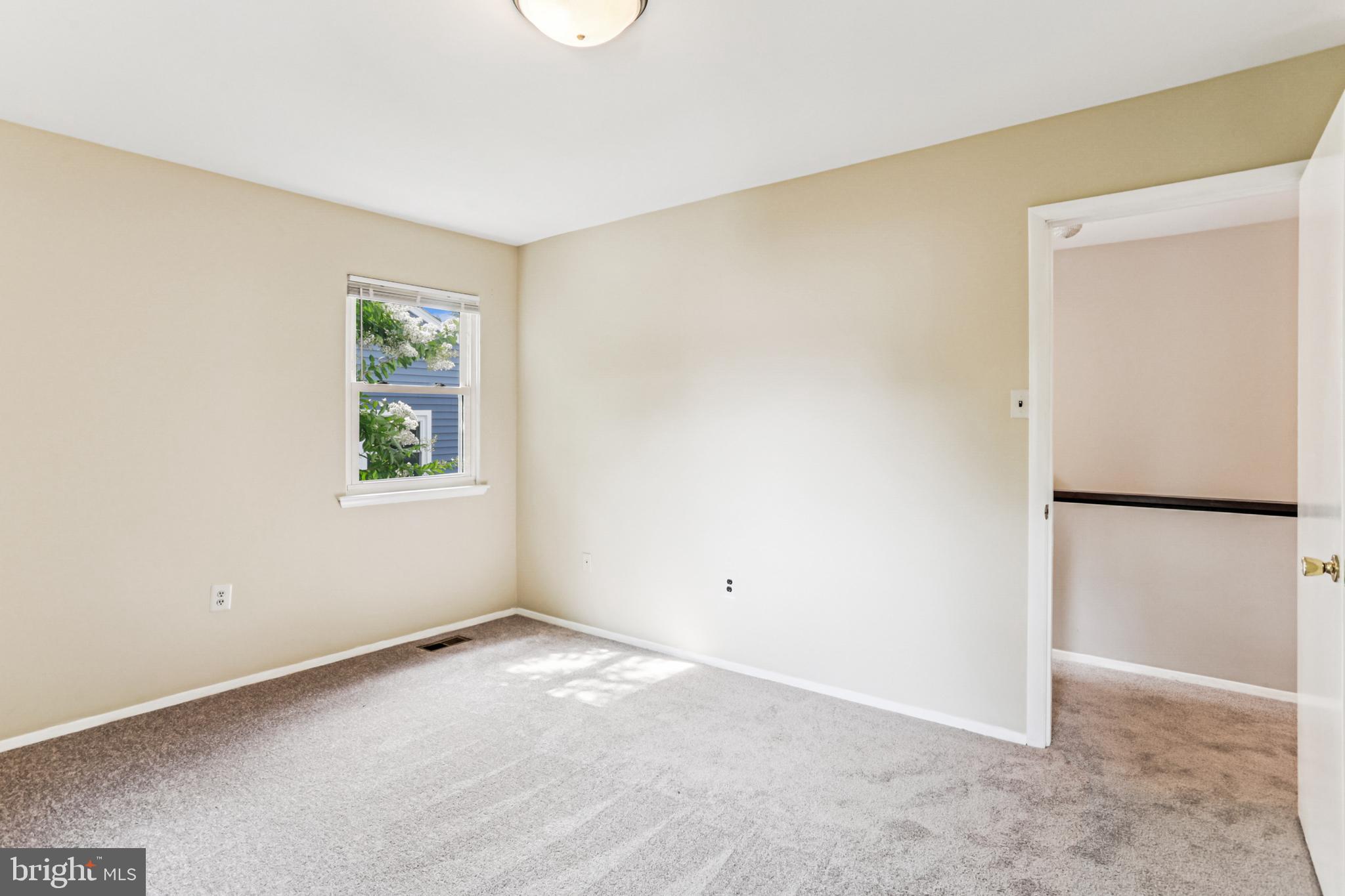 9013 2nd Avenue Silver Spring, MD 20910 - Photo 37 of 56 an empty room with windows and refrigerator