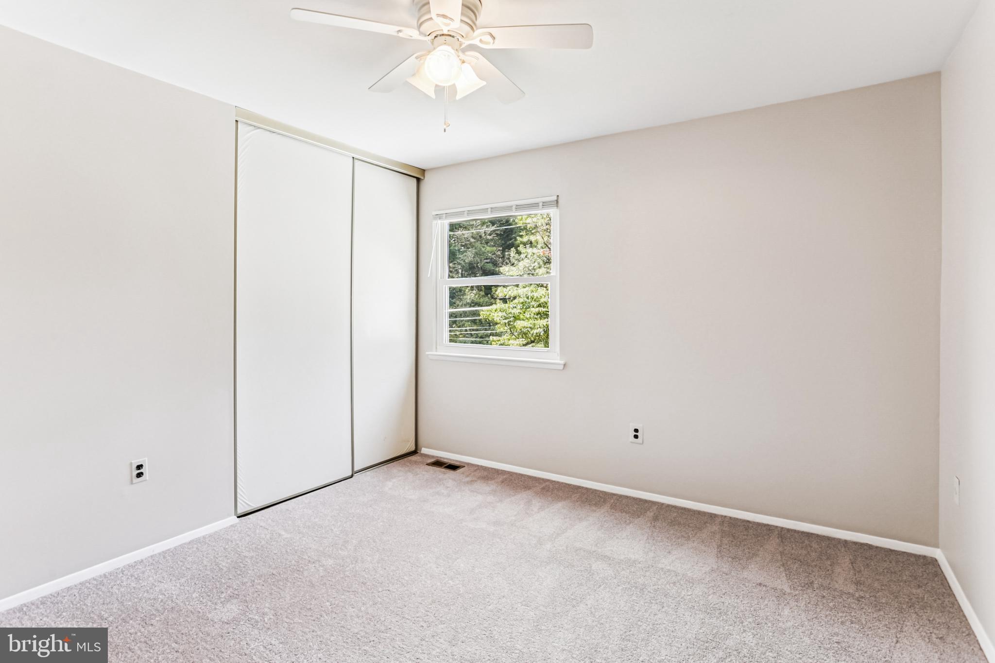 9013 2nd Avenue Silver Spring, MD 20910 - Photo 39 of 56 an empty room with a window and a fan