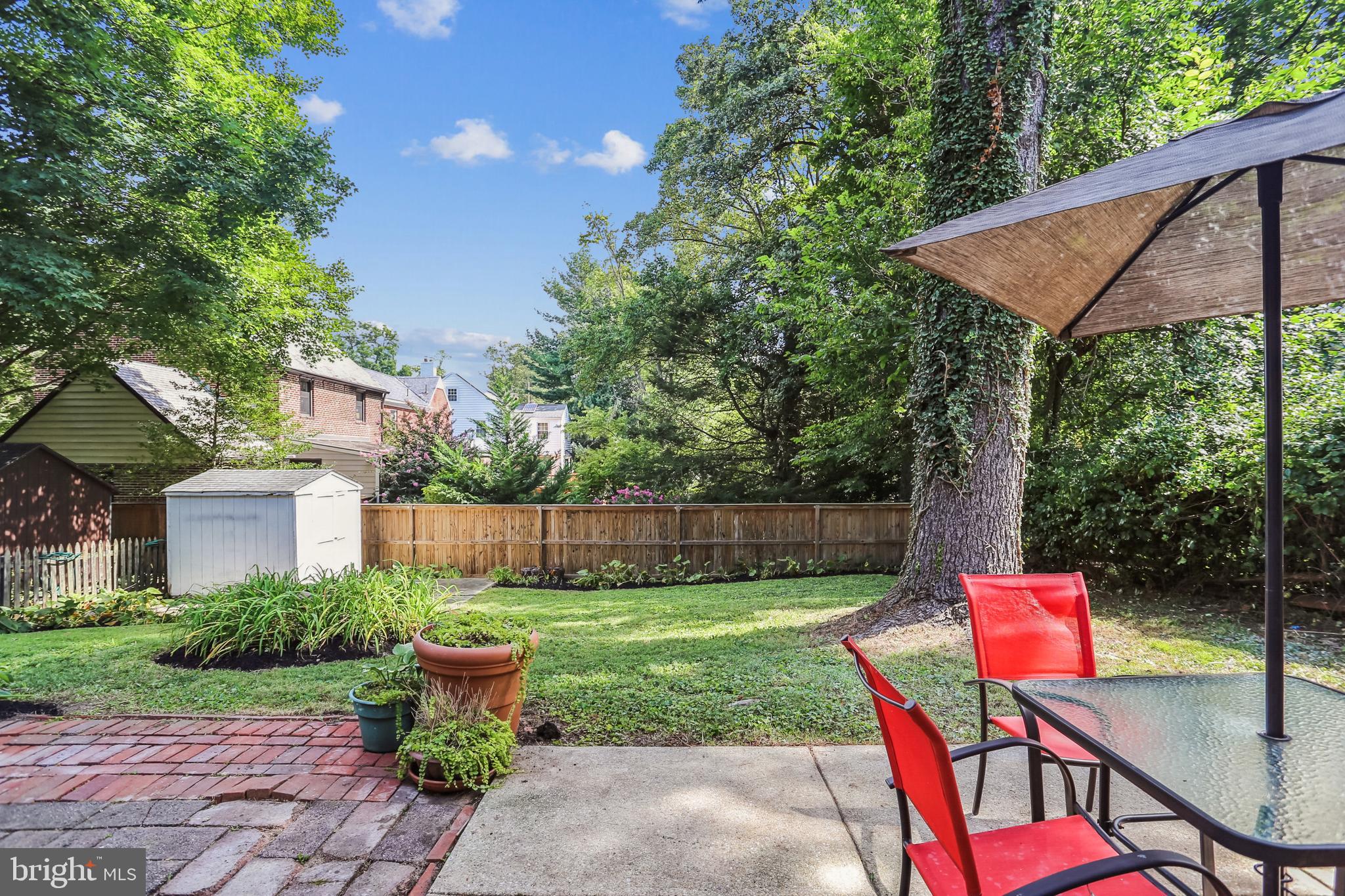 9013 2nd Avenue Silver Spring, MD 20910 - Photo 49 of 56 a backyard of a house with table and chairs