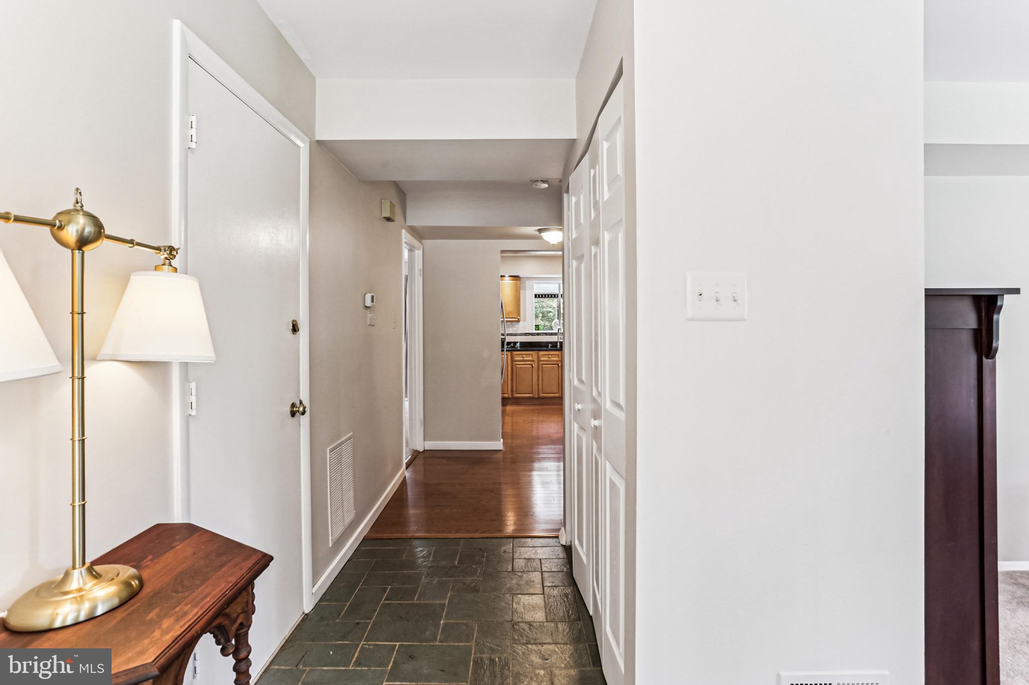 9013 2nd Avenue Silver Spring, MD 20910 - Photo 6 of 56 a view of a hallway with furniture and a bathroom