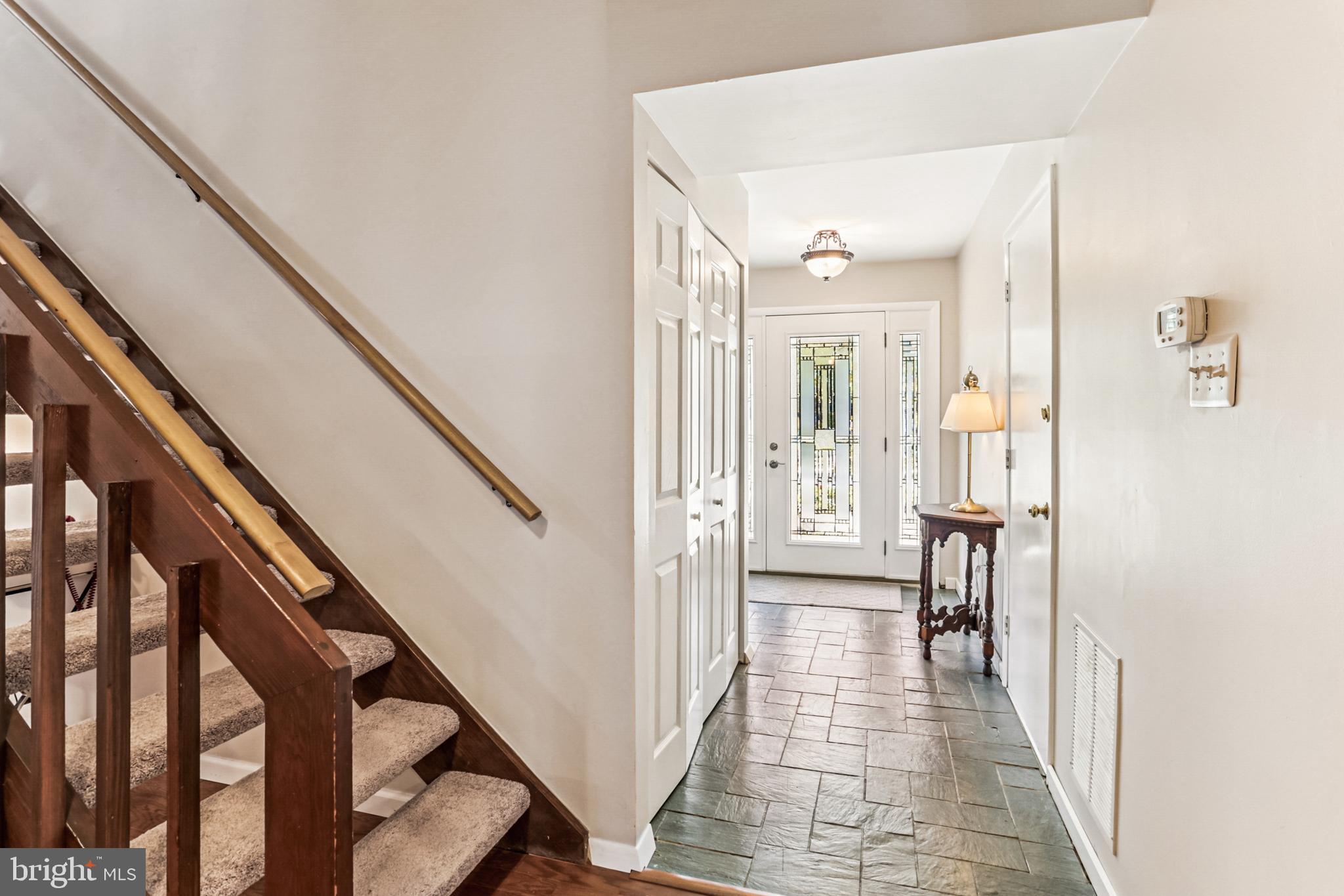 9013 2nd Avenue Silver Spring, MD 20910 - Photo 7 of 56 a view of a hallway with wooden floor and staircase
