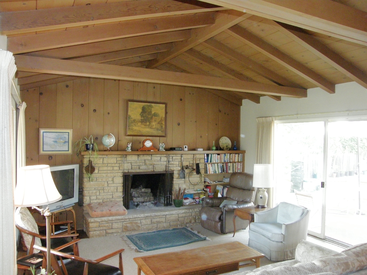 2222 Feather Hill Road Santa Barbara, CA 93108 - Photo 5 of 18 a living room with furniture a flat screen tv and a fireplace