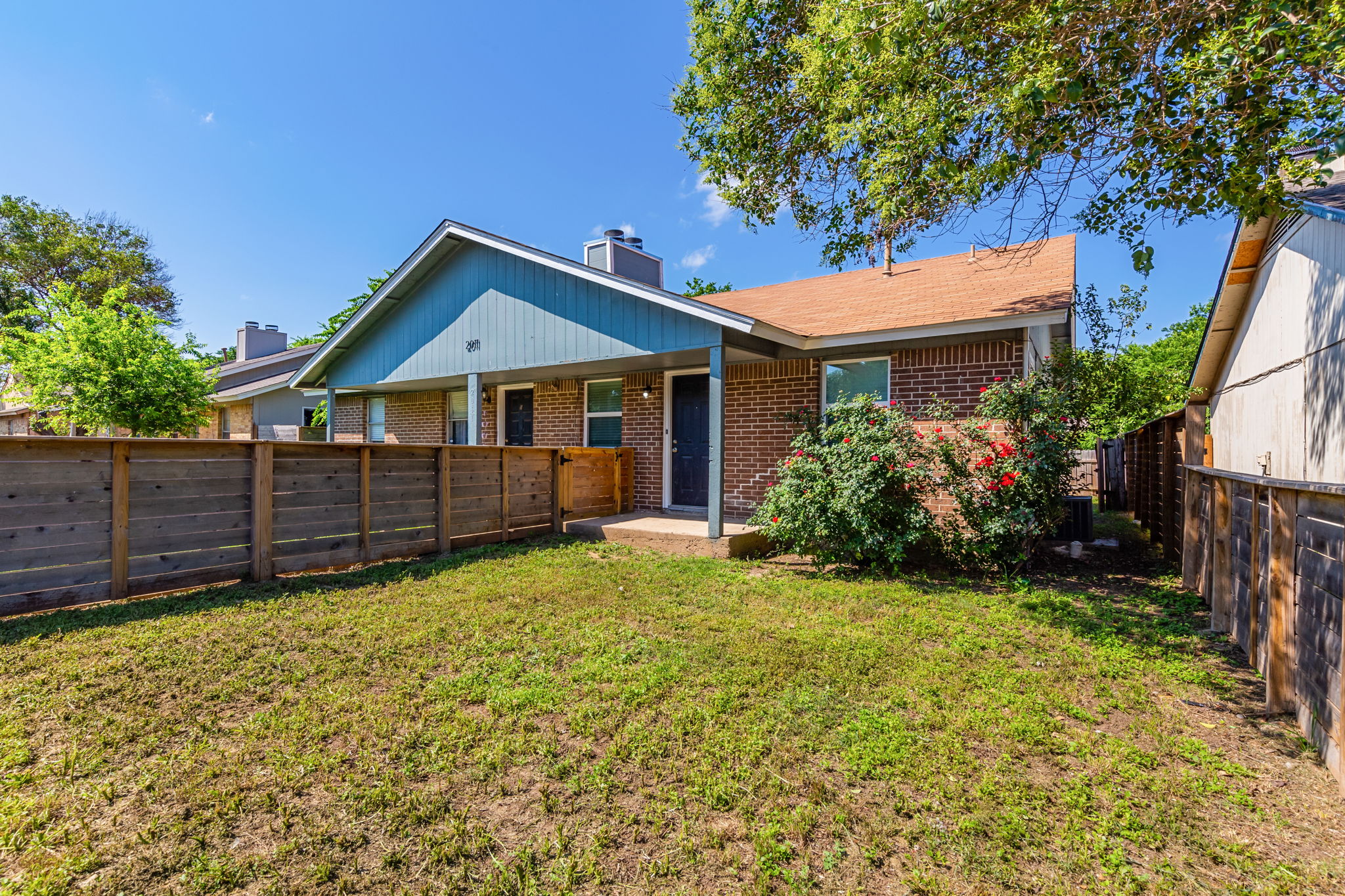 2011 East Stassney Lane, Unit A Austin, TX 78744 - Photo 1 of 23 a house with trees in the background