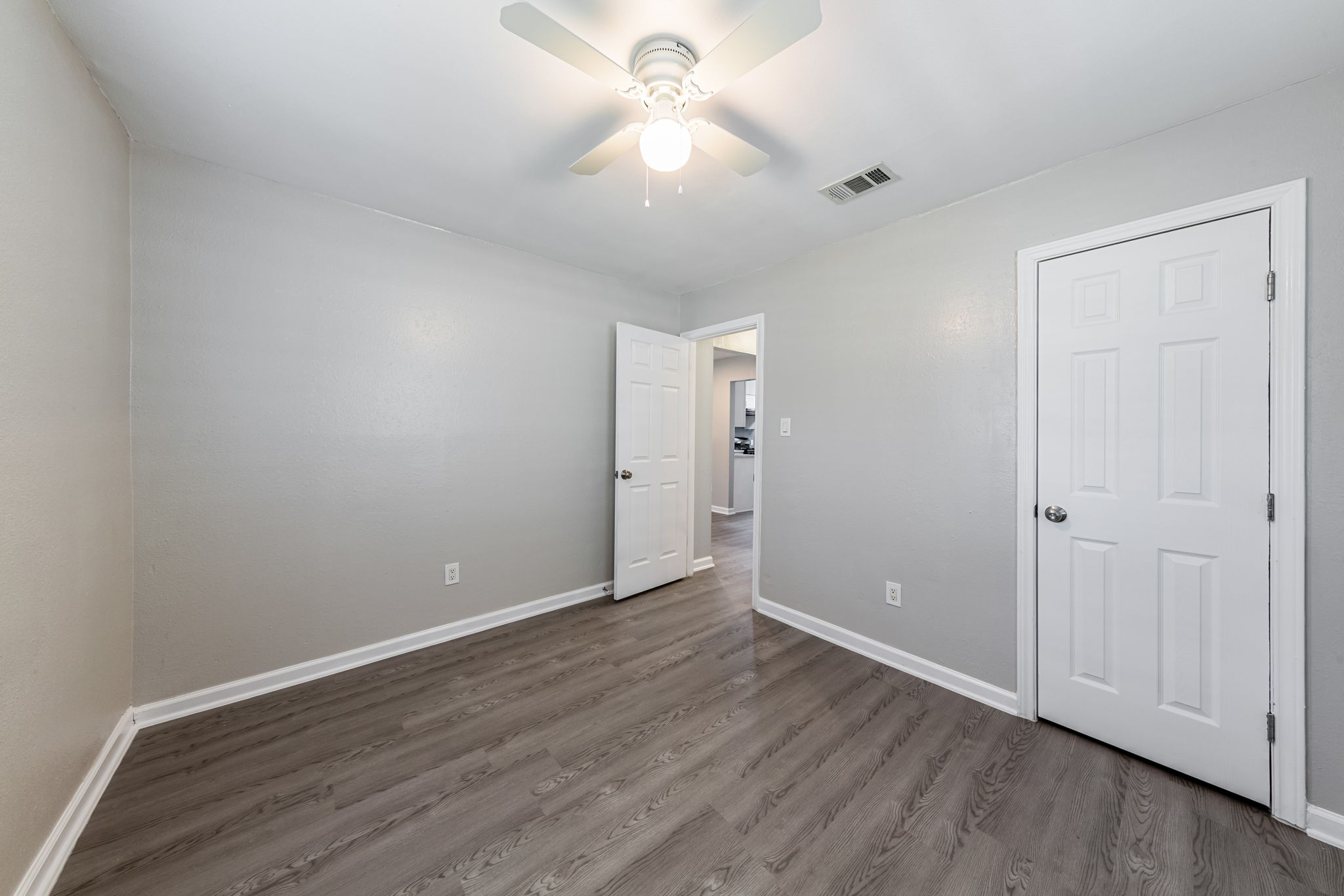 2011 East Stassney Lane, Unit A Austin, TX 78744 - Photo 13 of 23 a view of an empty room with wooden floor