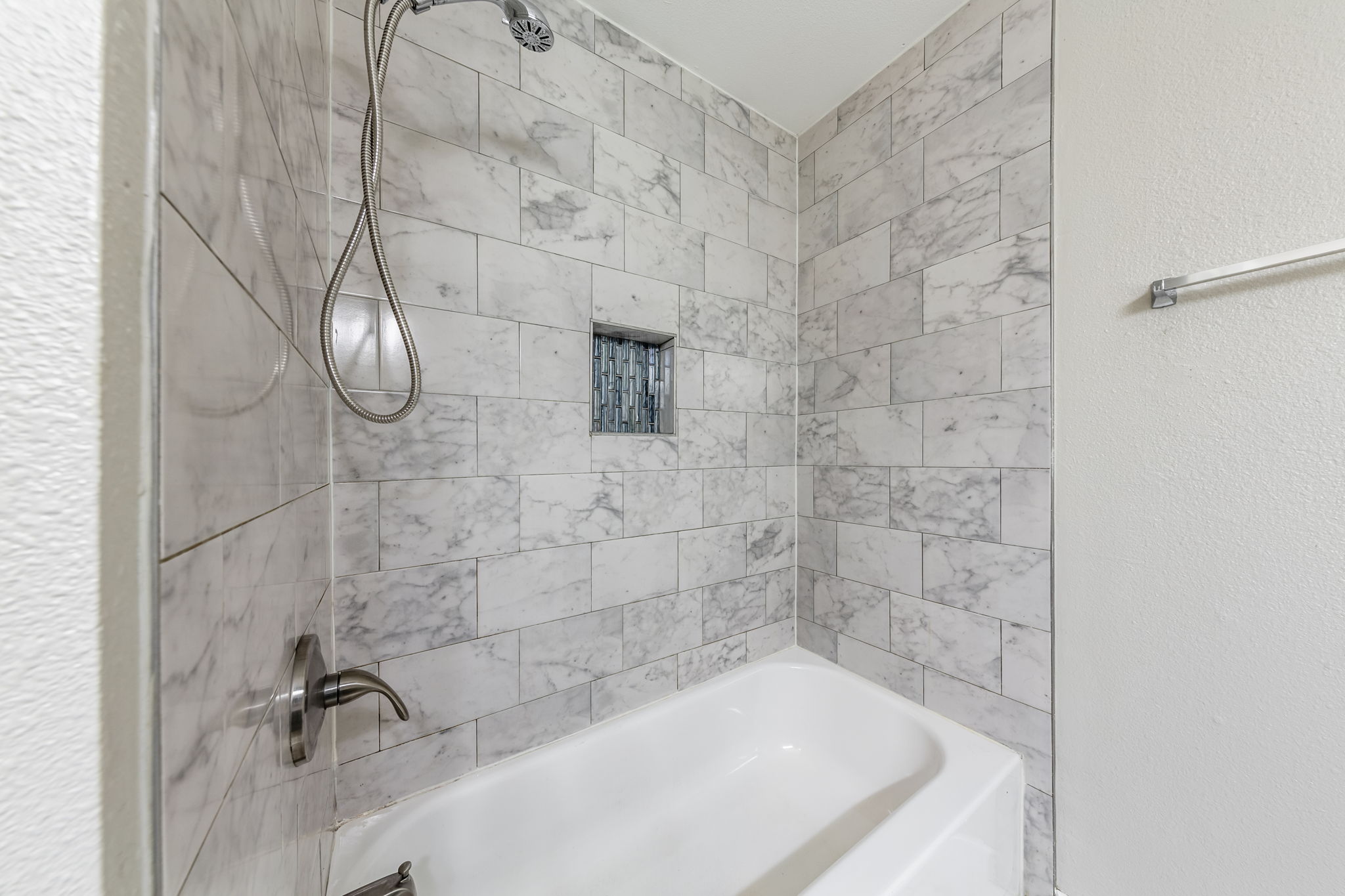 2011 East Stassney Lane, Unit A Austin, TX 78744 - Photo 15 of 23 a bath tub sitting next to a shower
