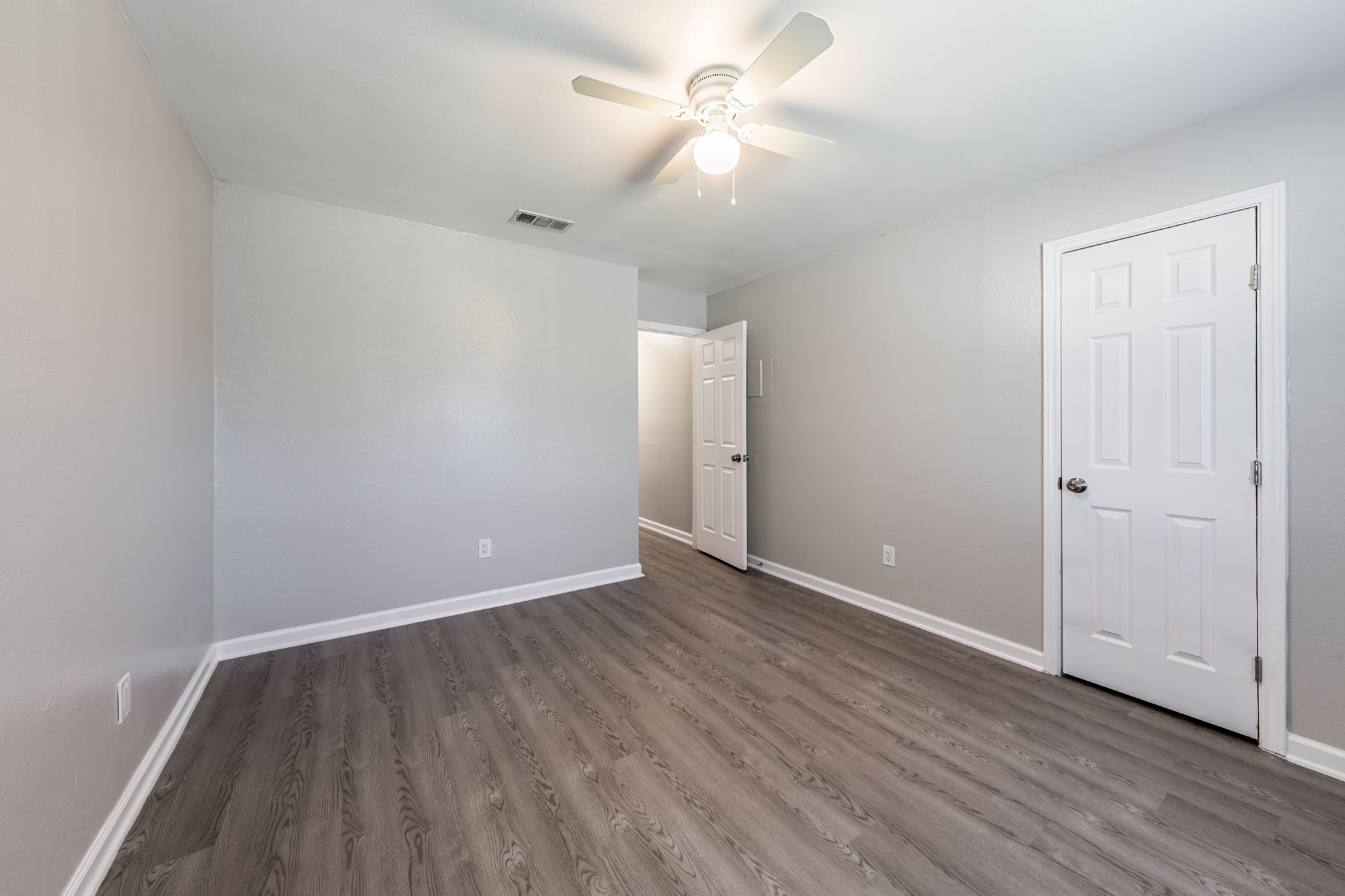 2011 East Stassney Lane, Unit A Austin, TX 78744 - Photo 18 of 23 a view of an empty room with wooden floor