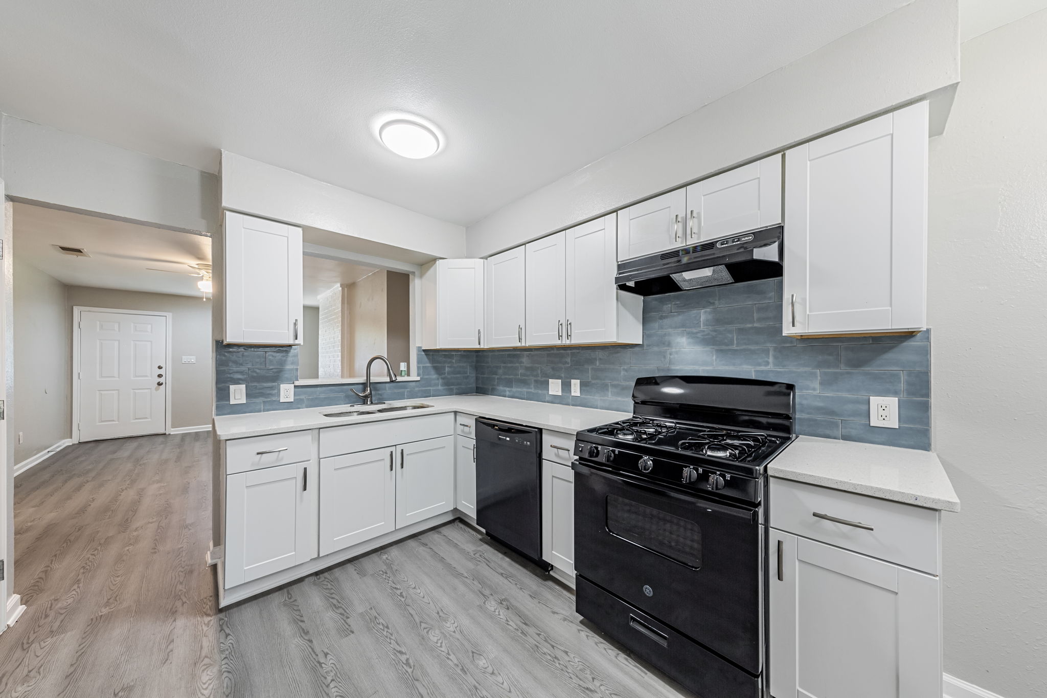 2011 East Stassney Lane, Unit A Austin, TX 78744 - Photo 8 of 23 a kitchen with stainless steel appliances granite countertop a stove and a sink