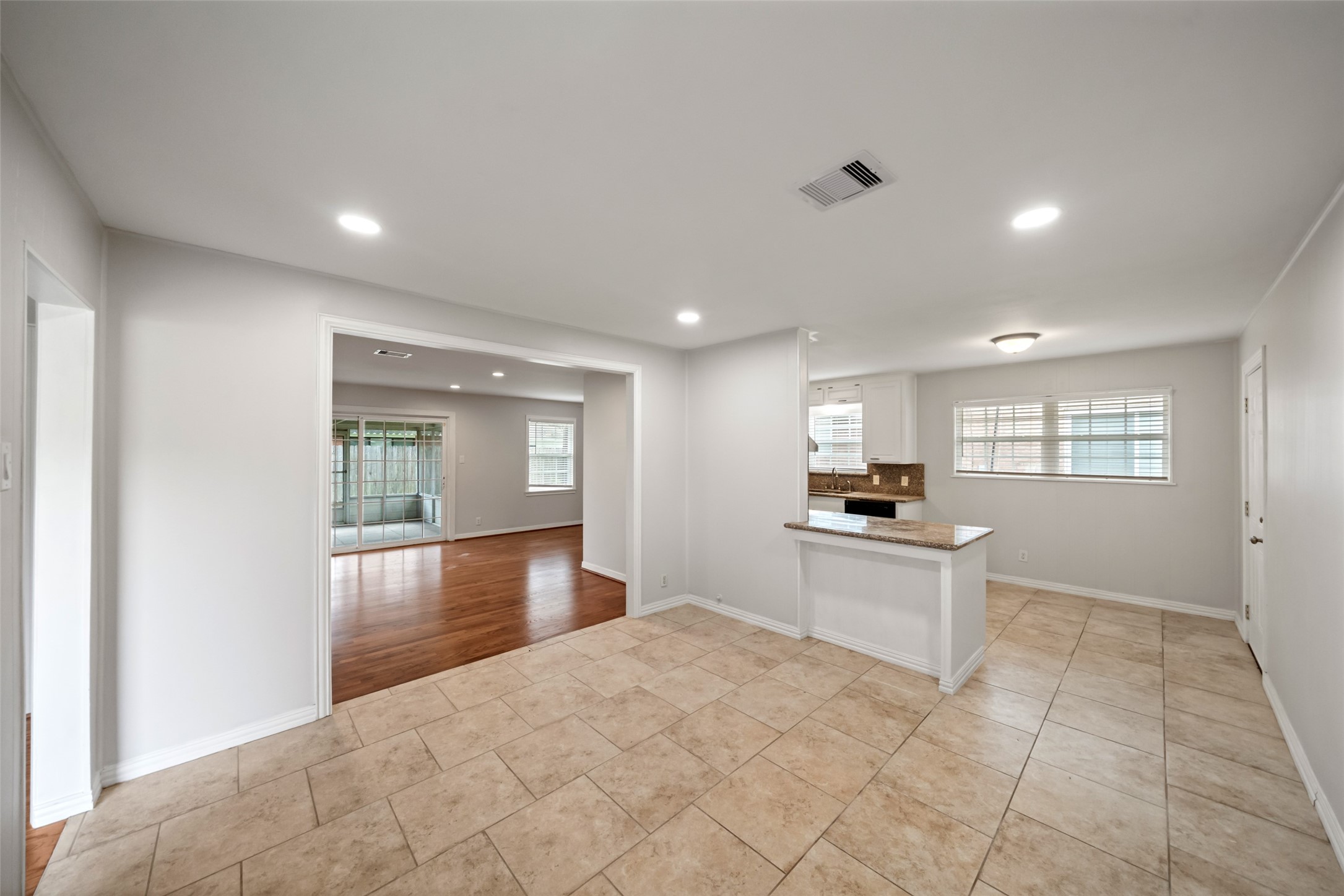 9779 Westview Drive Houston, TX 77055 - Photo 11 of 27 a view of a kitchen with a sink and a living room