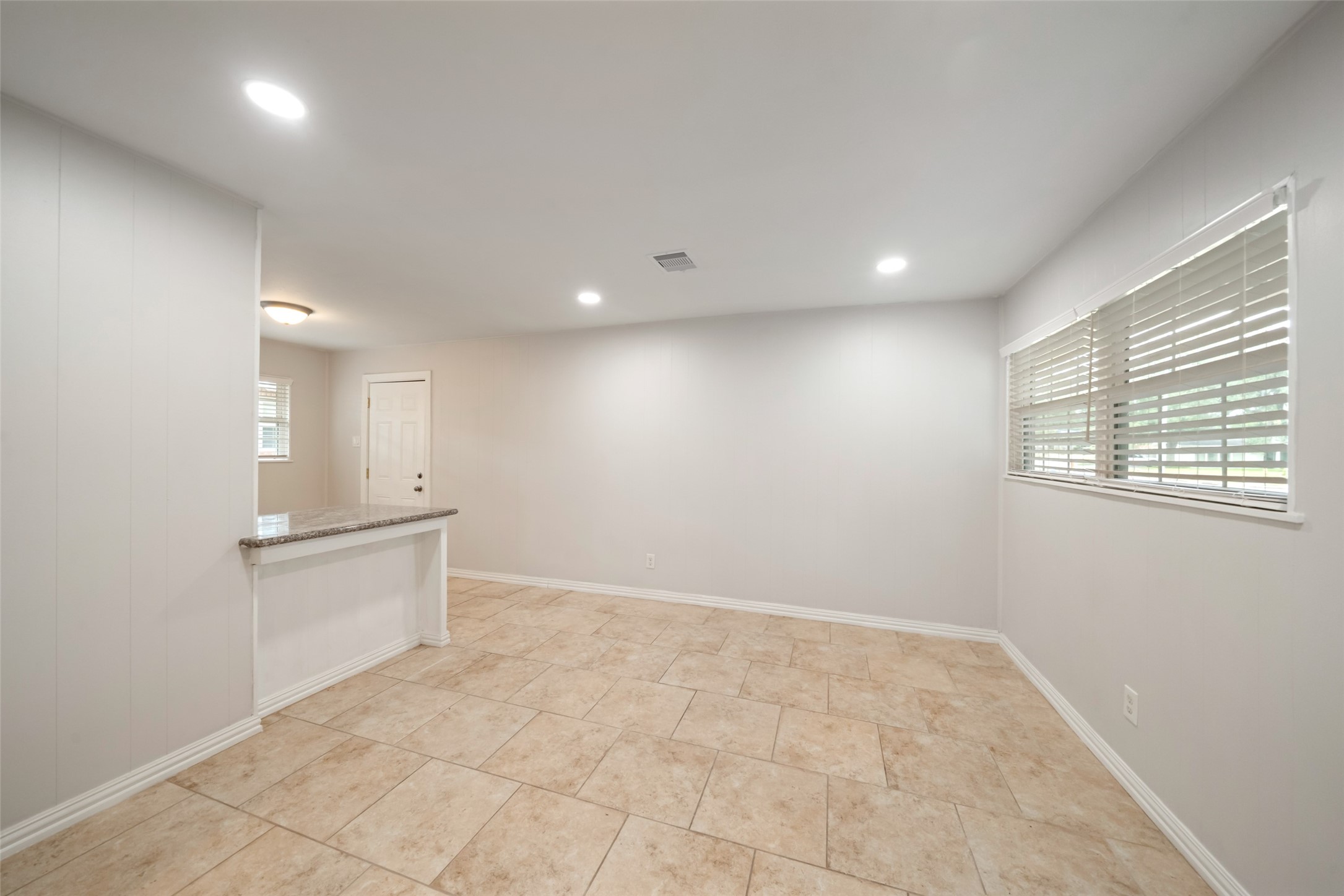 9779 Westview Drive Houston, TX 77055 - Photo 12 of 27 an empty room with white cabinet and mirrors