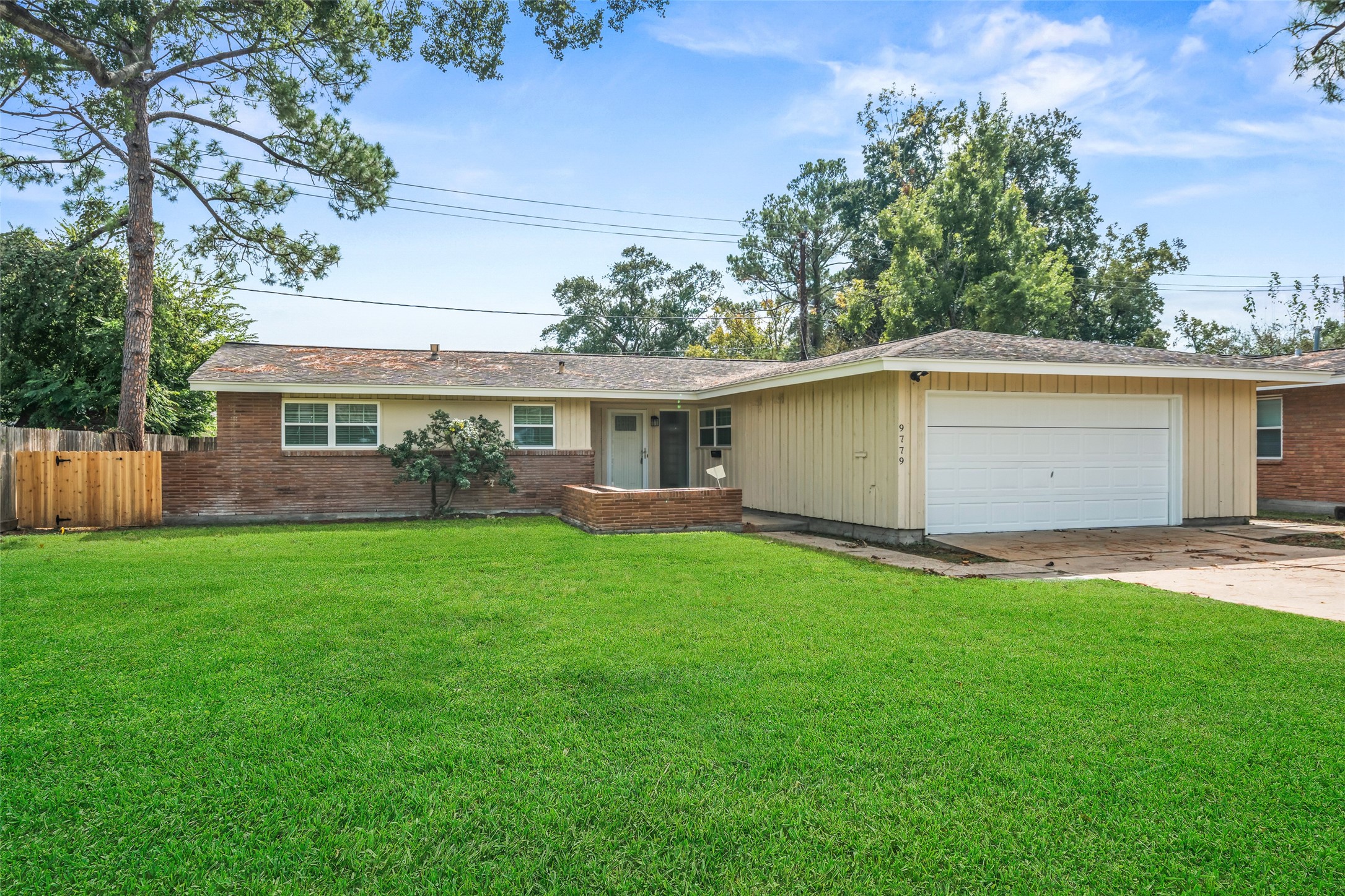 9779 Westview Drive Houston, TX 77055 - Photo 2 of 27 a view of a yard with a house