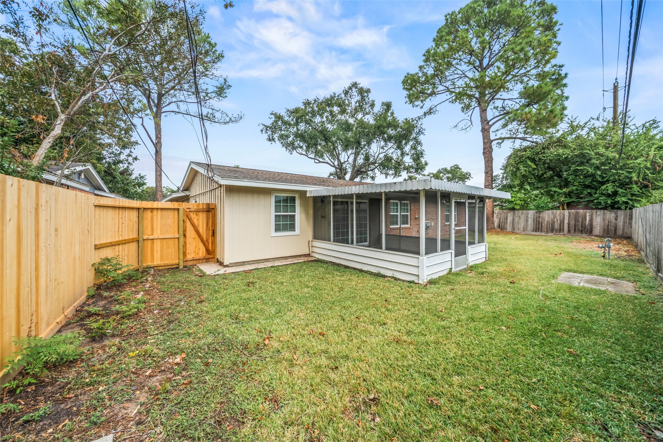9779 Westview Drive Houston, TX 77055 - Photo 26 of 27 a view of a house with a backyard and a large tree