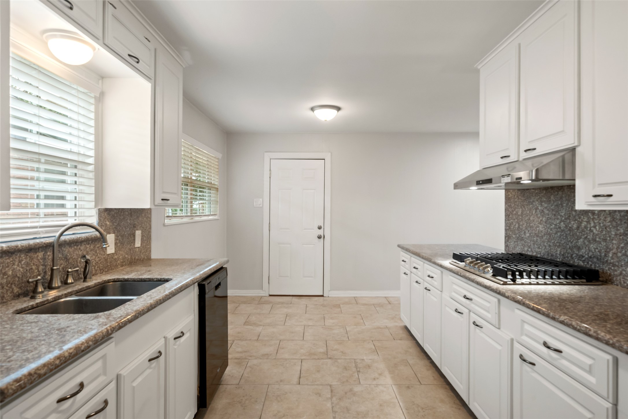 9779 Westview Drive Houston, TX 77055 - Photo 7 of 27 a kitchen that has a sink and a stove