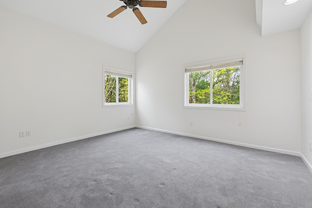 3002 Maple Brook Road, Unit 3002 Bellingham, MA 02019 - Photo 27 of 42 an empty room with windows and fan