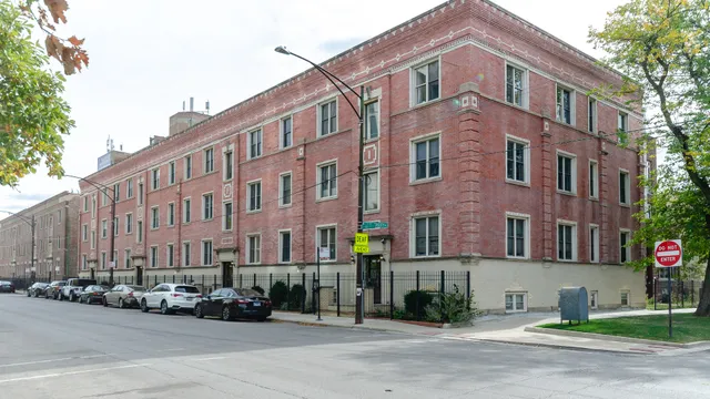a street corner with a building in the background