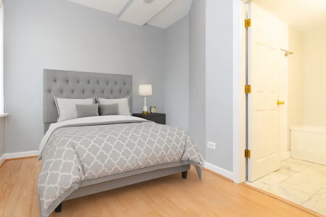 a bedroom with a bed and a cabinets