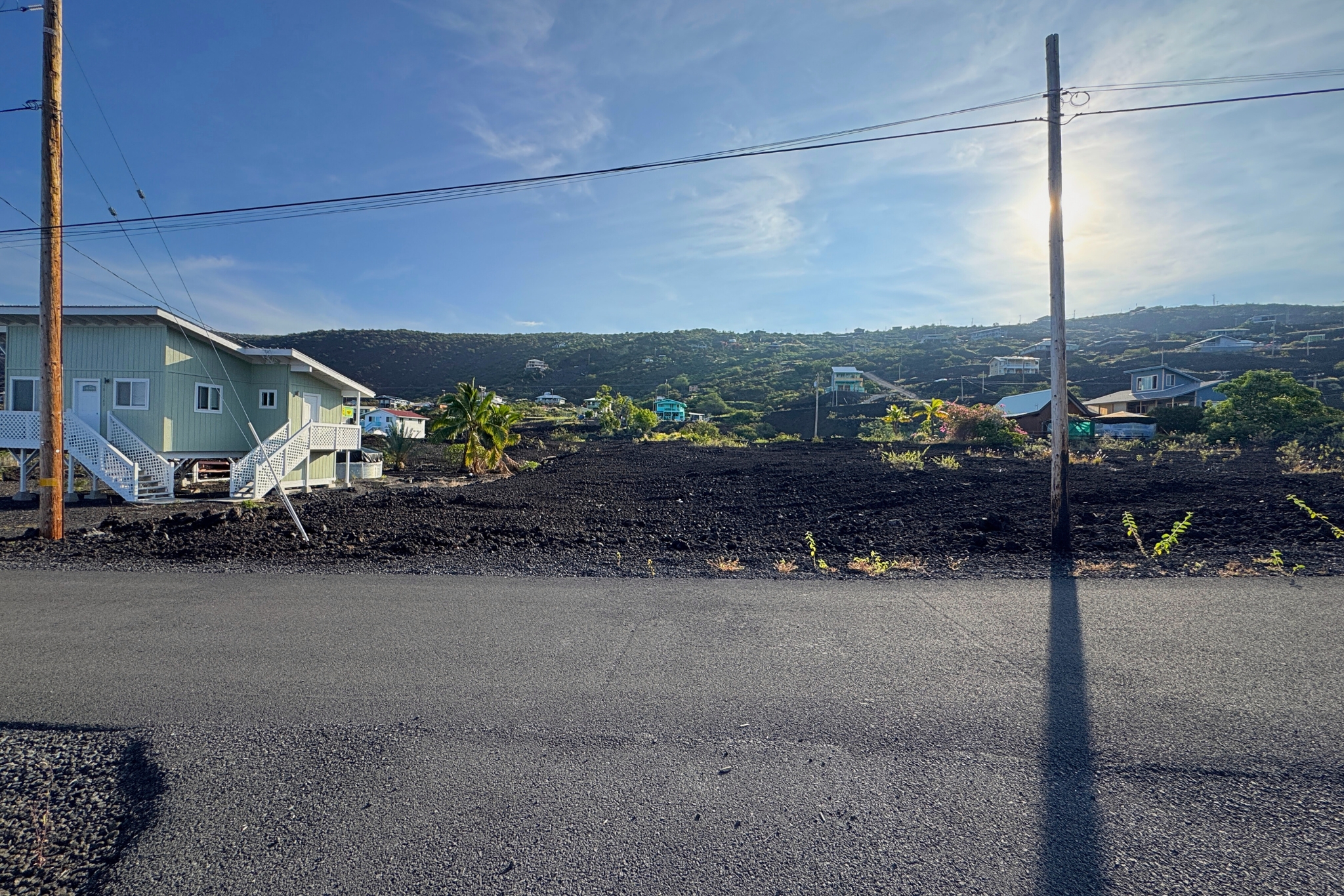 88-1546 Ehiku Avenue Captain Cook, HI 96704 - Photo 8 of 14 a view of a road with a parking space