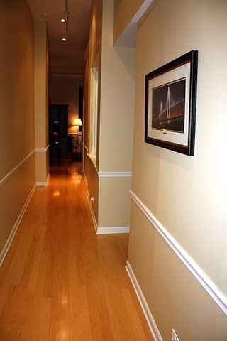 807 Church Street, Unit 407 Evanston, IL 60201 - Photo 4 of 9 a view of a hallway with wooden floor and a bathroom
