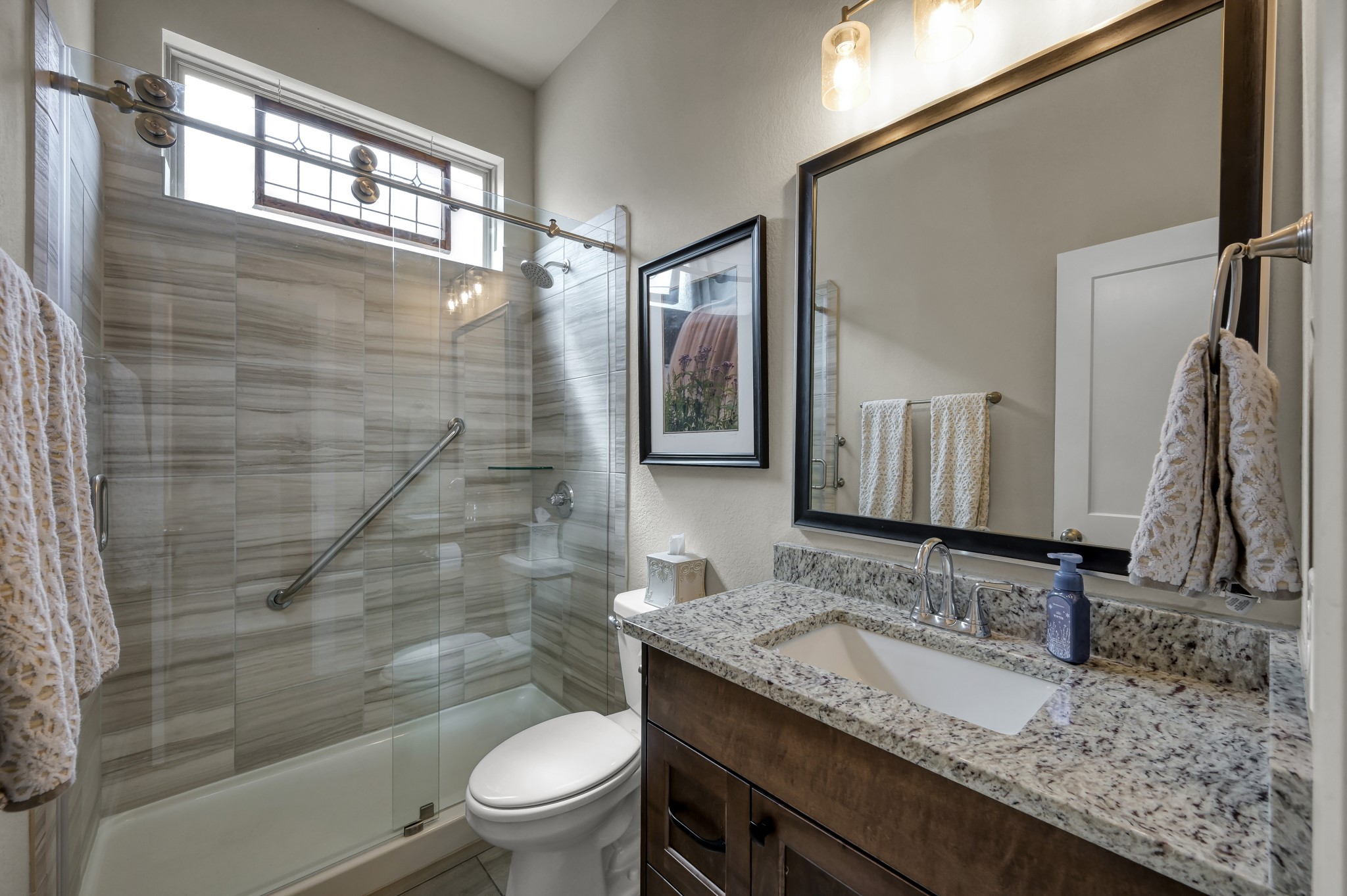 111 Yellow Perch Way Conroe, TX 77318 - Photo 18 of 35 Upgraded walk-in shower with support handrails for added comfort and accessibility.