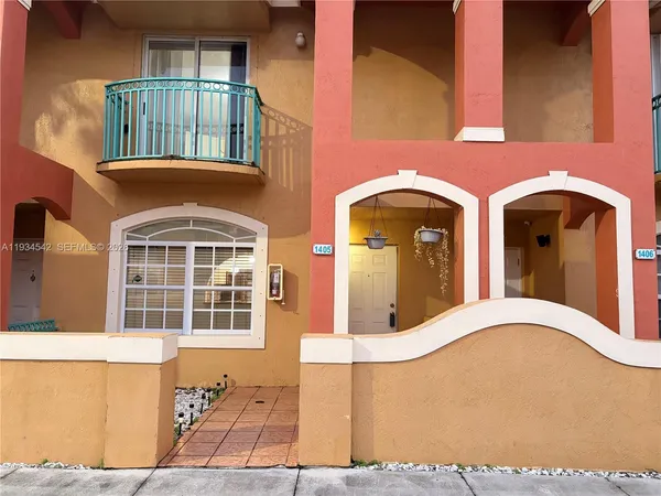 a front view of a house with large windows