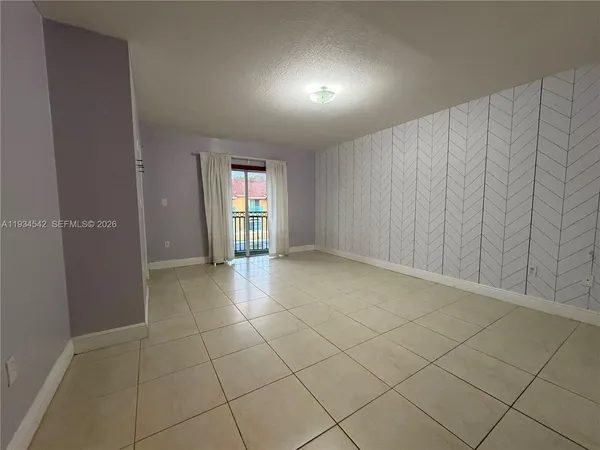 a view of a porch with a floor to ceiling window