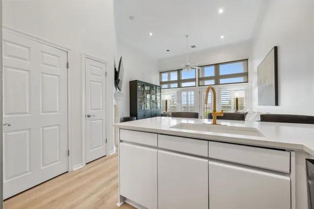 a kitchen with a sink and cabinets