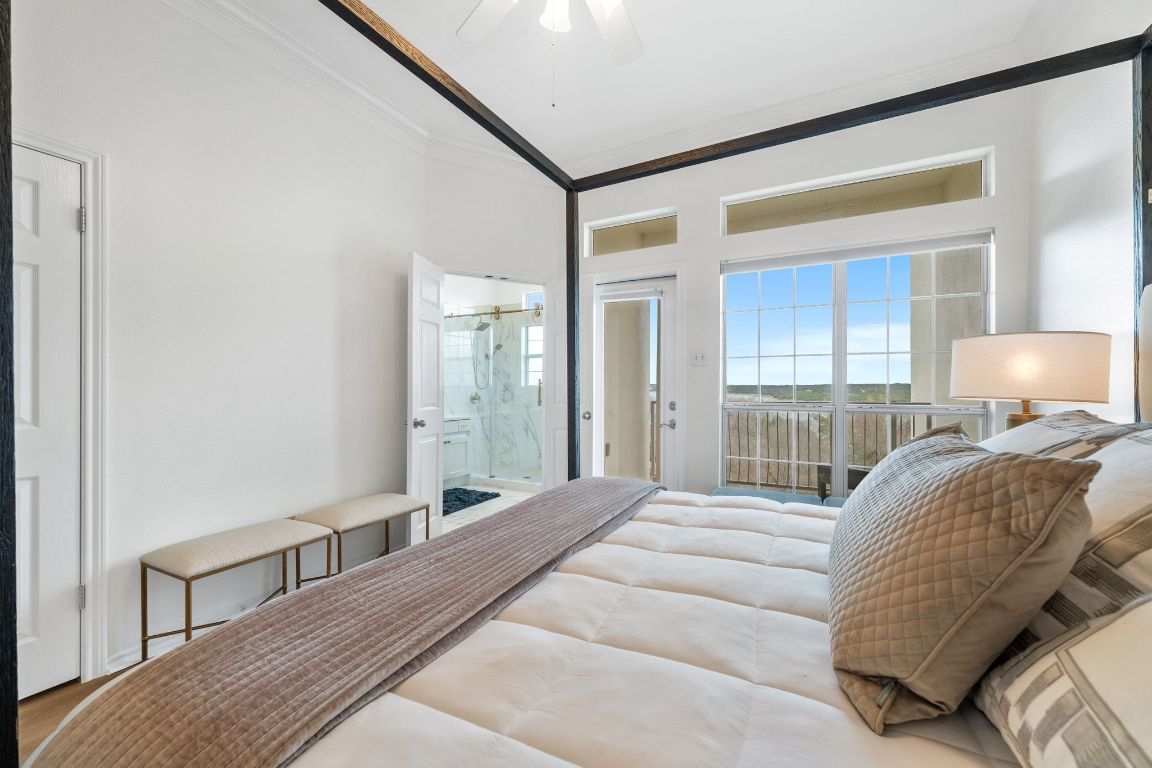 2918 Ranch Road 620, Unit 161 Austin, TX 78734 - Photo 15 of 35 a bedroom with a large bed and a large window