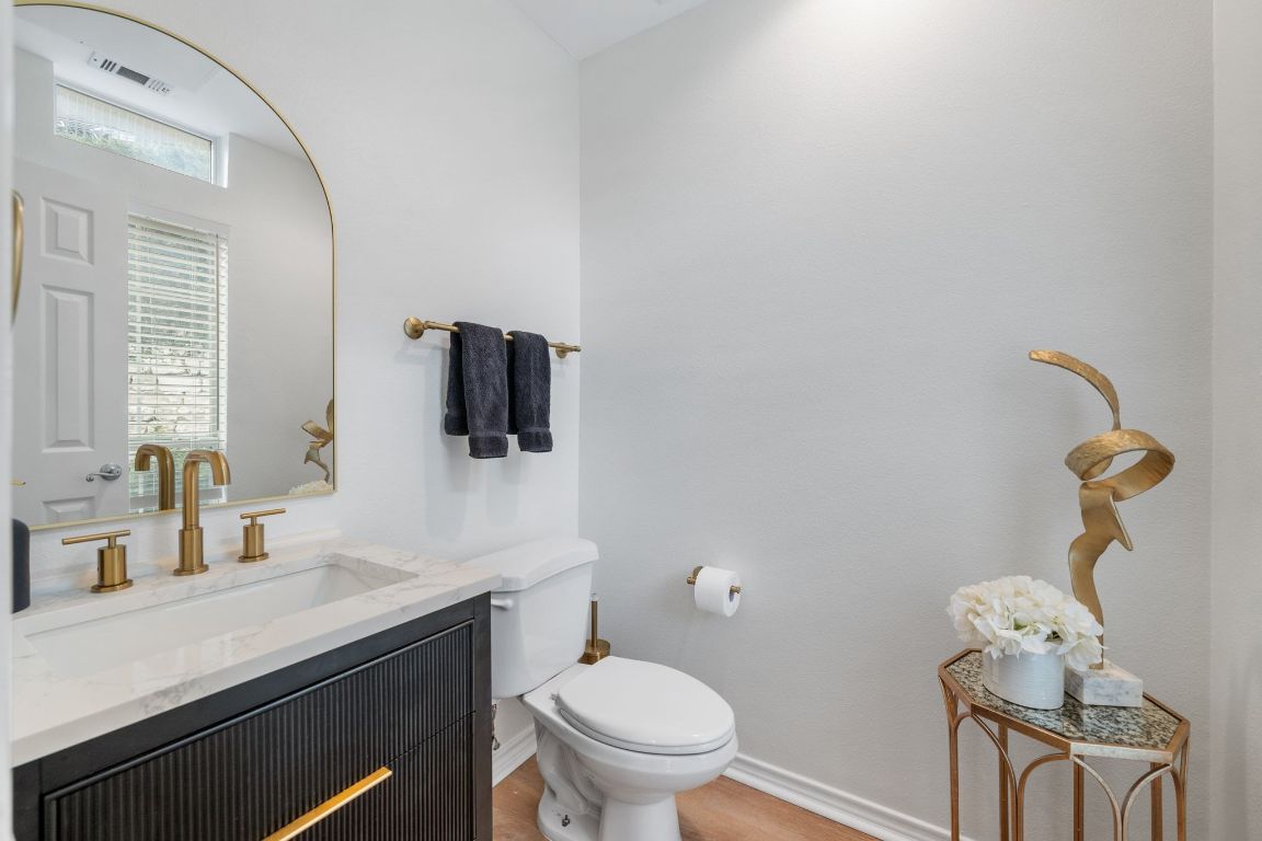 2918 Ranch Road 620, Unit 161 Austin, TX 78734 - Photo 18 of 35 a bathroom with a toilet sink and mirror