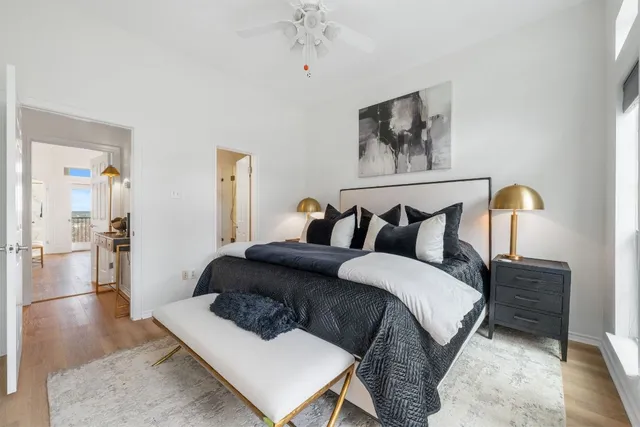 a spacious bedroom with a bed and a table