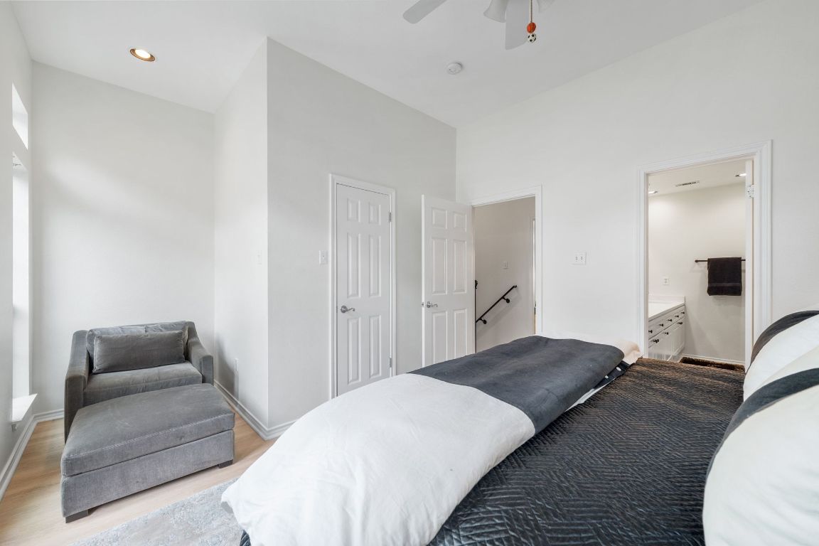 2918 Ranch Road 620, Unit 161 Austin, TX 78734 - Photo 23 of 35 a bedroom with a bed and a couch