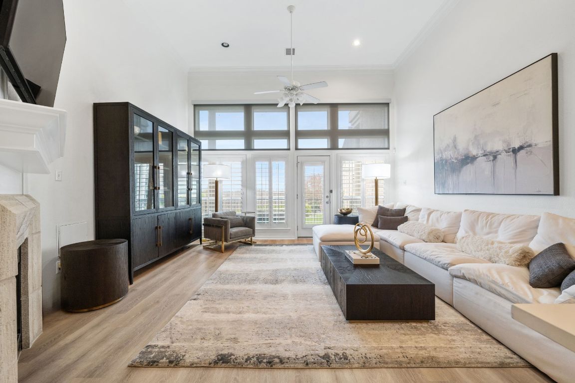 2918 Ranch Road 620, Unit 161 Austin, TX 78734 - Photo 4 of 35 a living room with furniture large window and flat screen tv