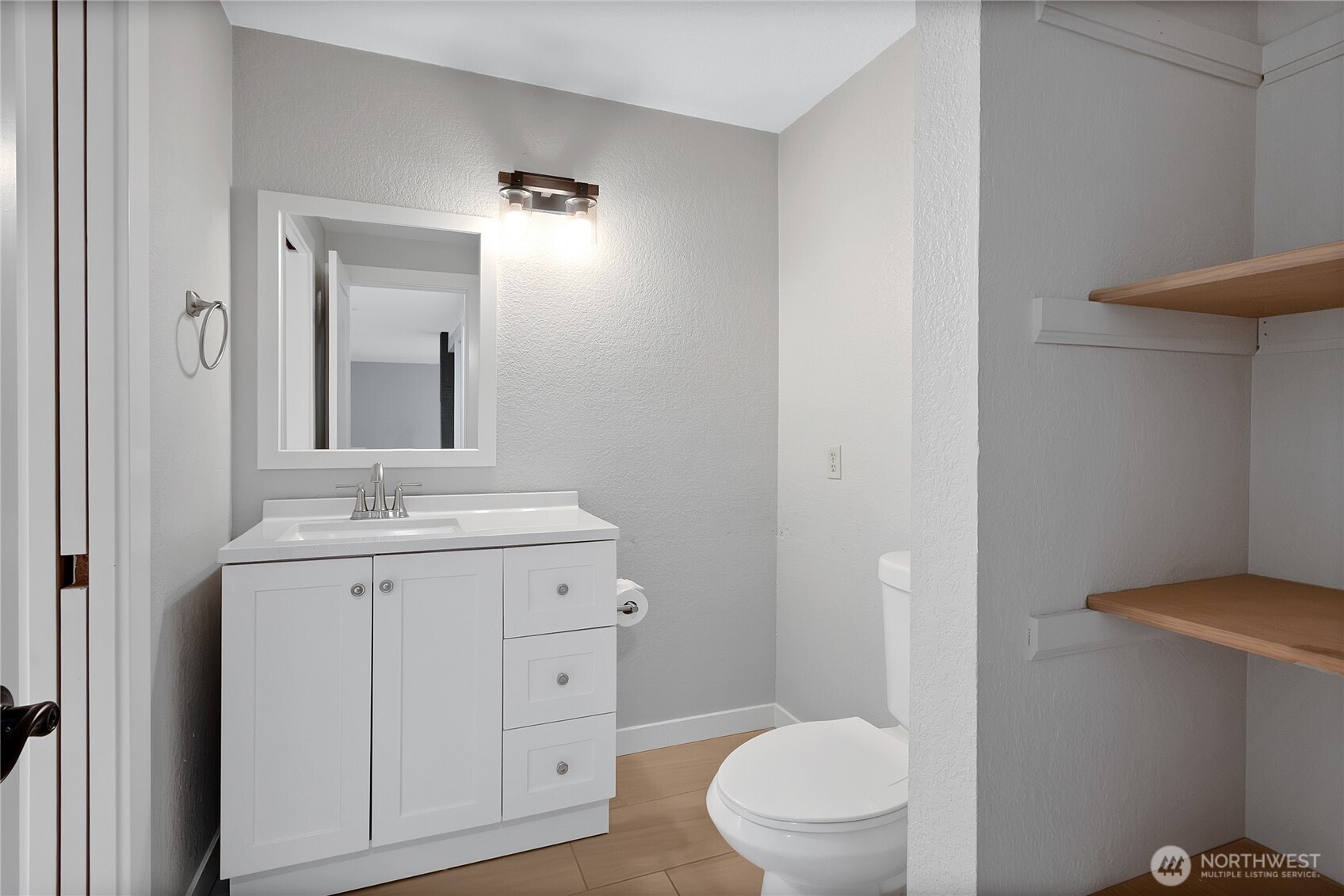 2881 Initial Avenue Enumclaw, WA 98022 - Photo 17 of 25 a bathroom with a toilet a sink and mirror