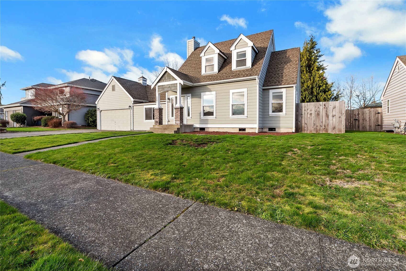 2881 Initial Avenue Enumclaw, WA 98022 - Photo 21 of 25 a front view of a house with a yard and garage