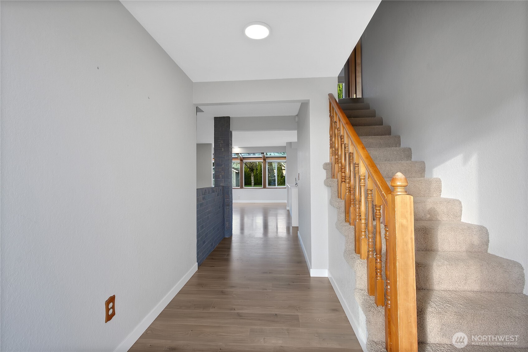 2881 Initial Avenue Enumclaw, WA 98022 - Photo 4 of 25 a view of a hallway with wooden floor and staircase