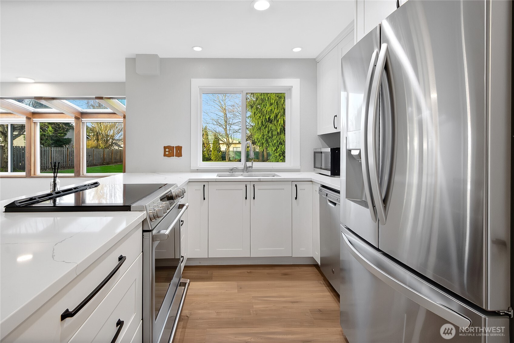 2881 Initial Avenue Enumclaw, WA 98022 - Photo 7 of 25 a kitchen with a sink stainless steel appliances and window