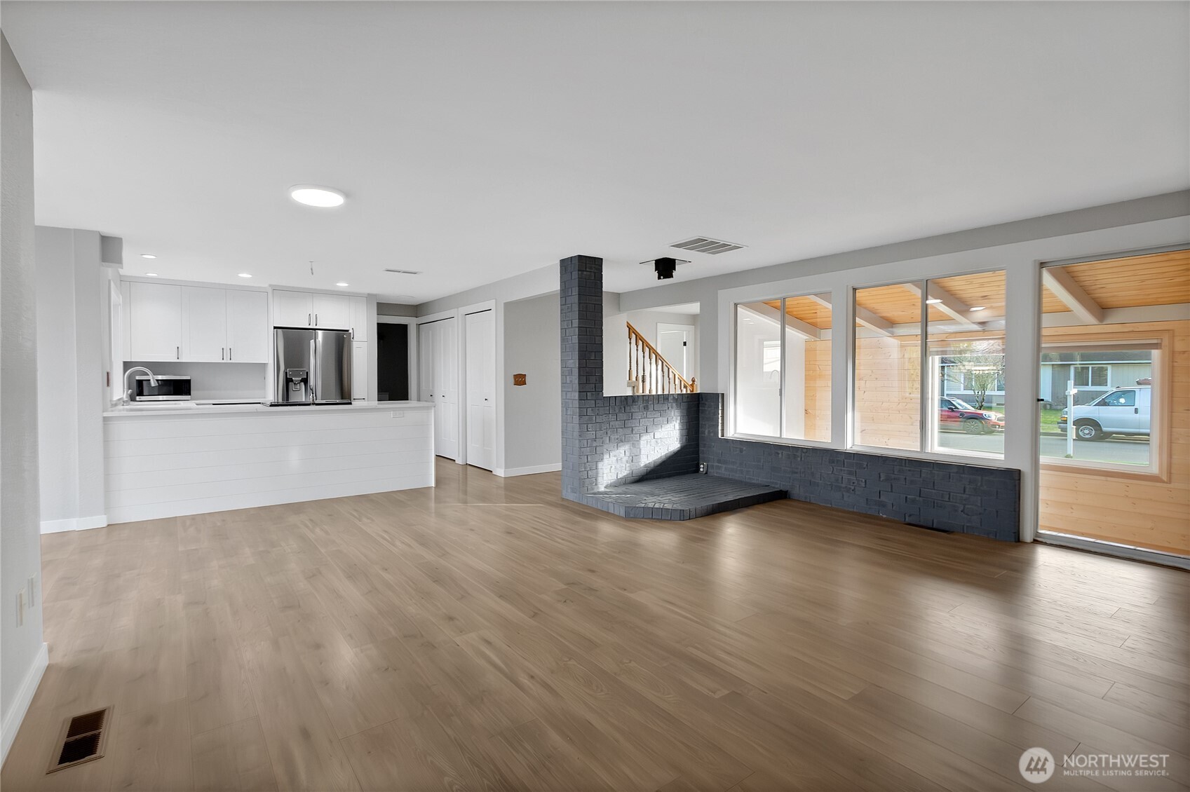 2881 Initial Avenue Enumclaw, WA 98022 - Photo 10 of 25 a view of a kitchen with wooden floor and a window