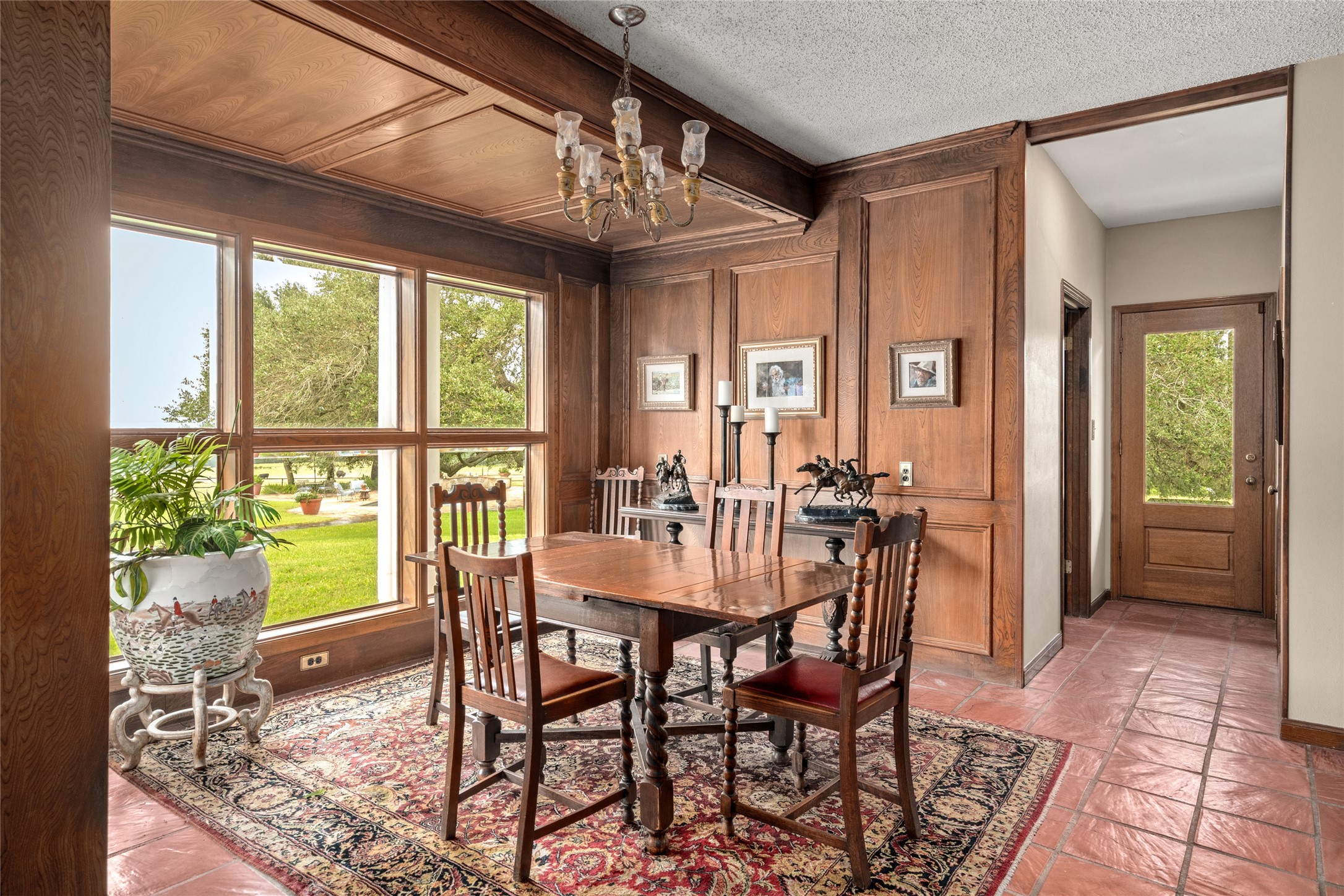 7023 Wolters Road Schulenburg, TX 78956 - Photo 13 of 49 a view of a dining room with furniture wooden floor and chandelier