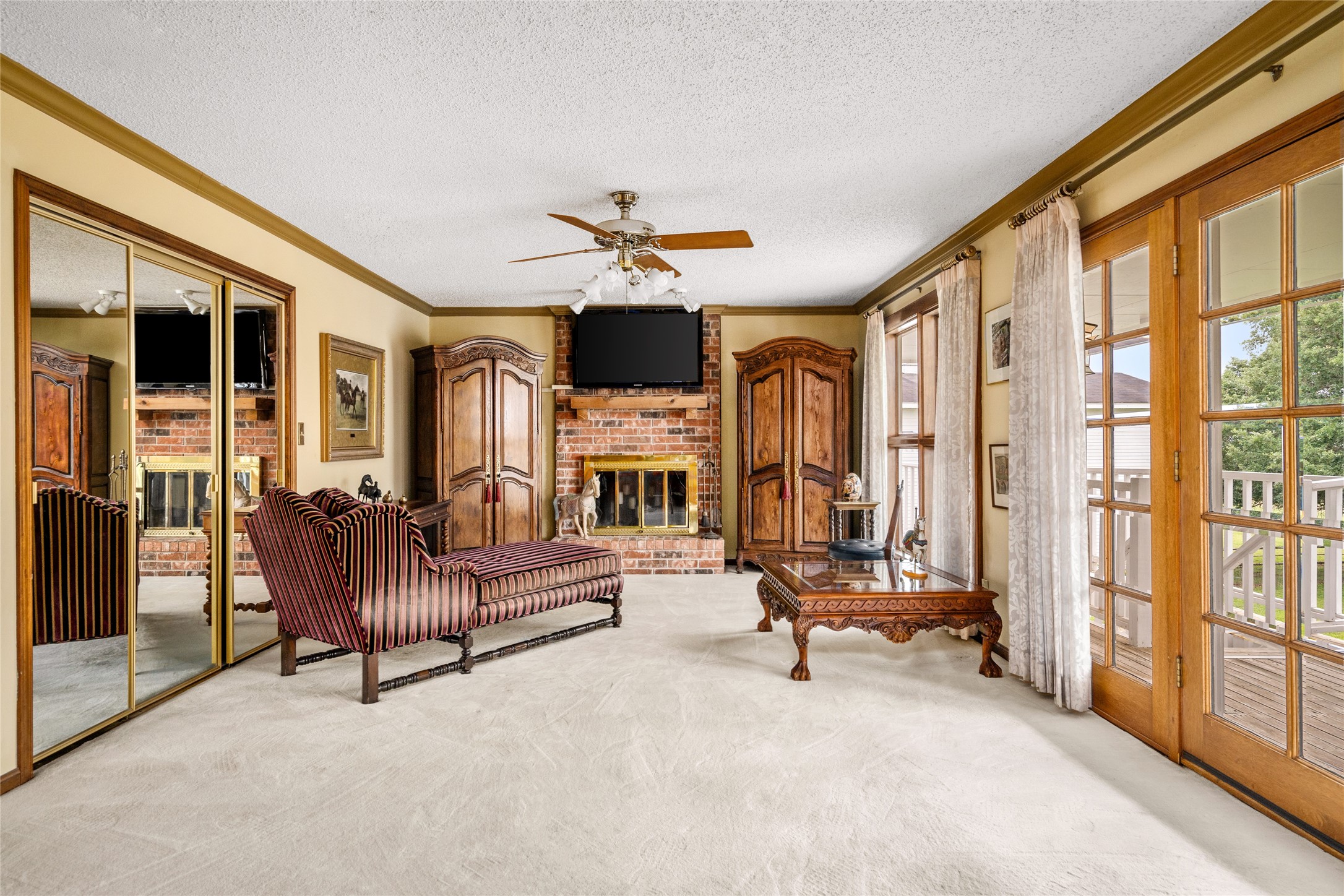 7023 Wolters Road Schulenburg, TX 78956 - Photo 19 of 49 a living room with furniture flat screen tv and a large window