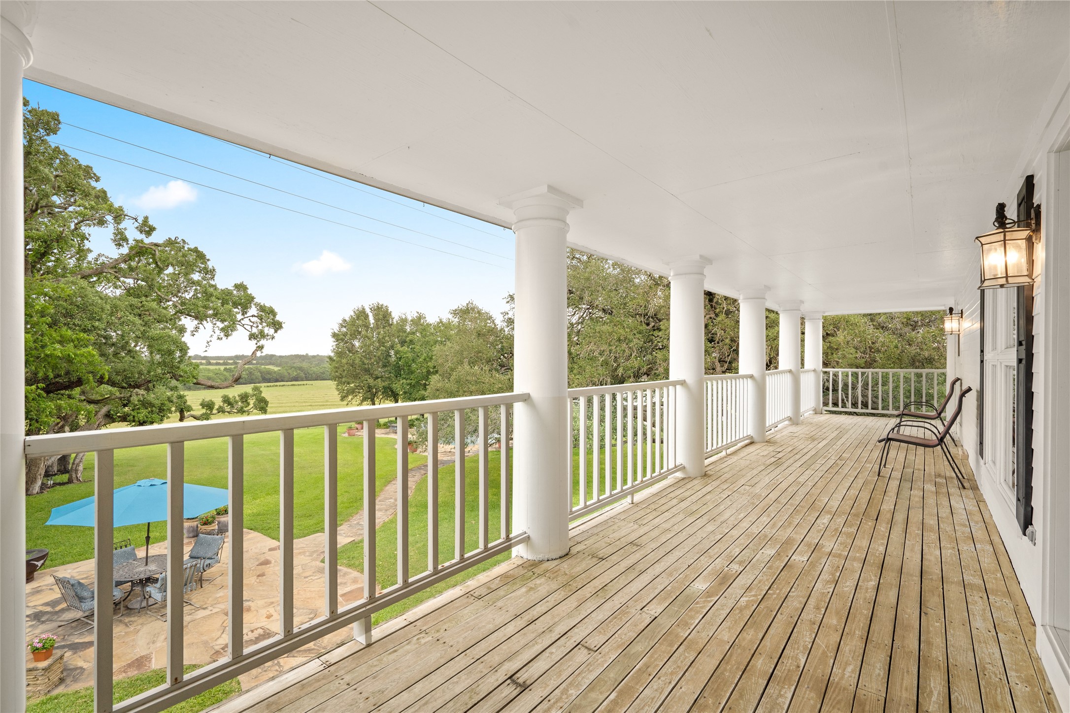 7023 Wolters Road Schulenburg, TX 78956 - Photo 22 of 49 a view of a balcony with wooden floor