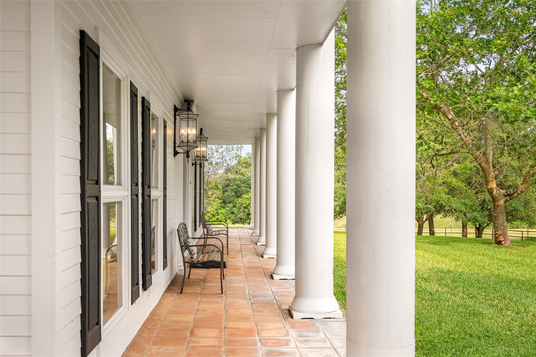 7023 Wolters Road Schulenburg, TX 78956 - Photo 3 of 49 a view of a balcony with wooden floor and outdoor space