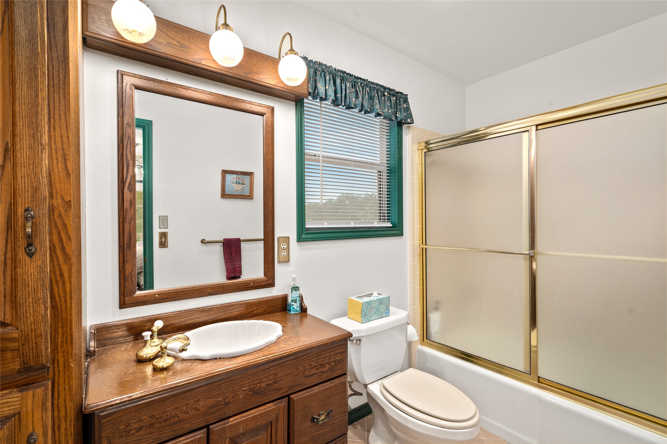 7023 Wolters Road Schulenburg, TX 78956 - Photo 31 of 49 a bathroom with a sink a toilet and shower